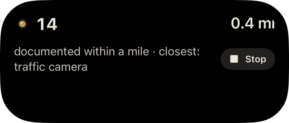 Expanded Dynamic Island: 14 and 0.4 mi, documented within a mile, closest traffic camera, with a Stop button.